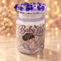 Purple Jewel Baby Memorial Candle on a warm golden studio backdrop