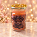 Golden Jewel Highland Cow Candle — matching studio backdrop