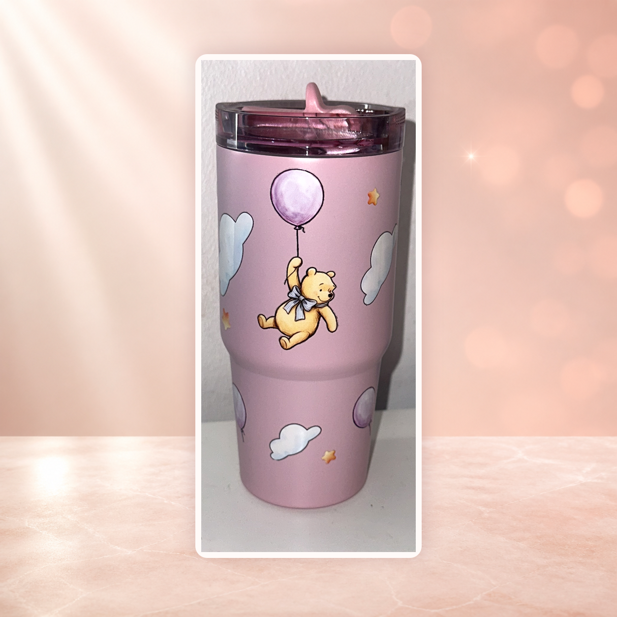 Pastel pink tumbler with balloon bear, clouds and stars